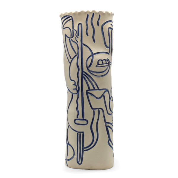 Tall cylindrical sculpture. The sculpture is ivory and etched with black lines depicting an abstract image of a figure playing a stringed instrument.