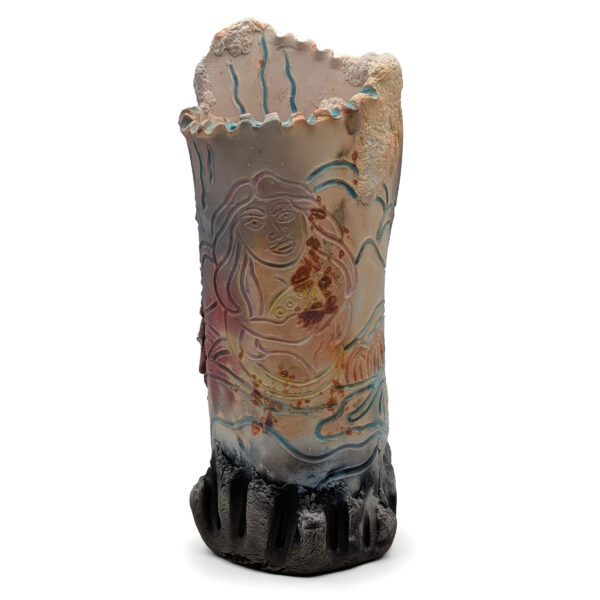 Cylindrical sculpture with an abstract drawing of a woman. The top of the sculpture has ridges.