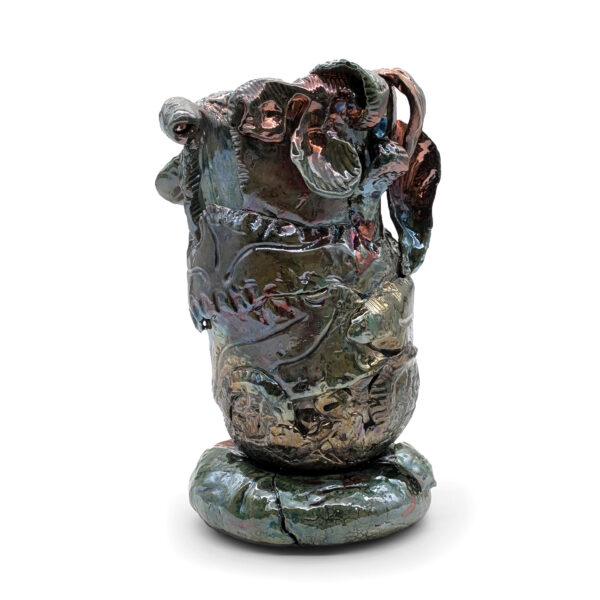 Round cylindrical sculpture in shades of dark greenish-gray.