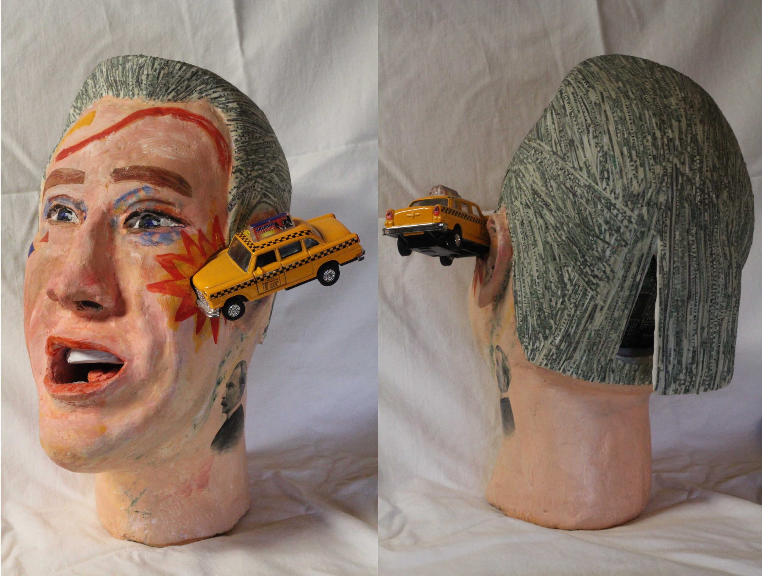 Image showing a bust. The head is a man with gray hair. A yellow taxicab has drawn a red roadmap across his face and appears to be crashing into the side of his head.
