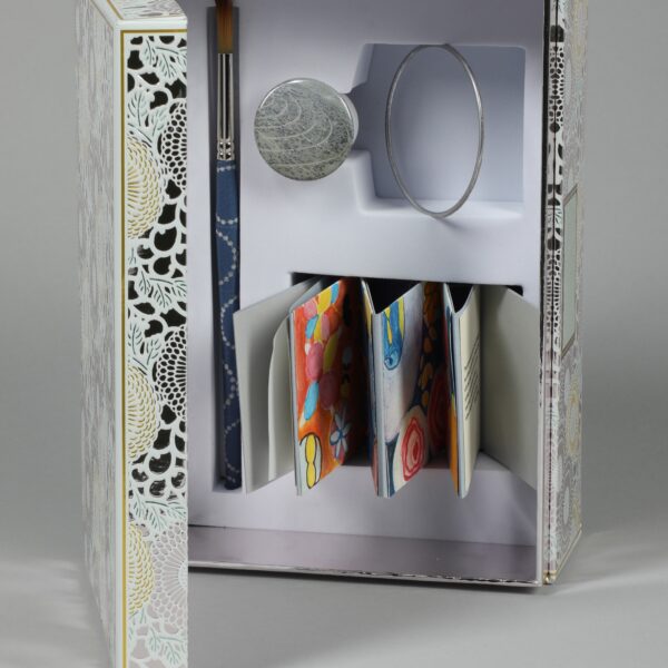 Image showing open box with folded-up papers inside.