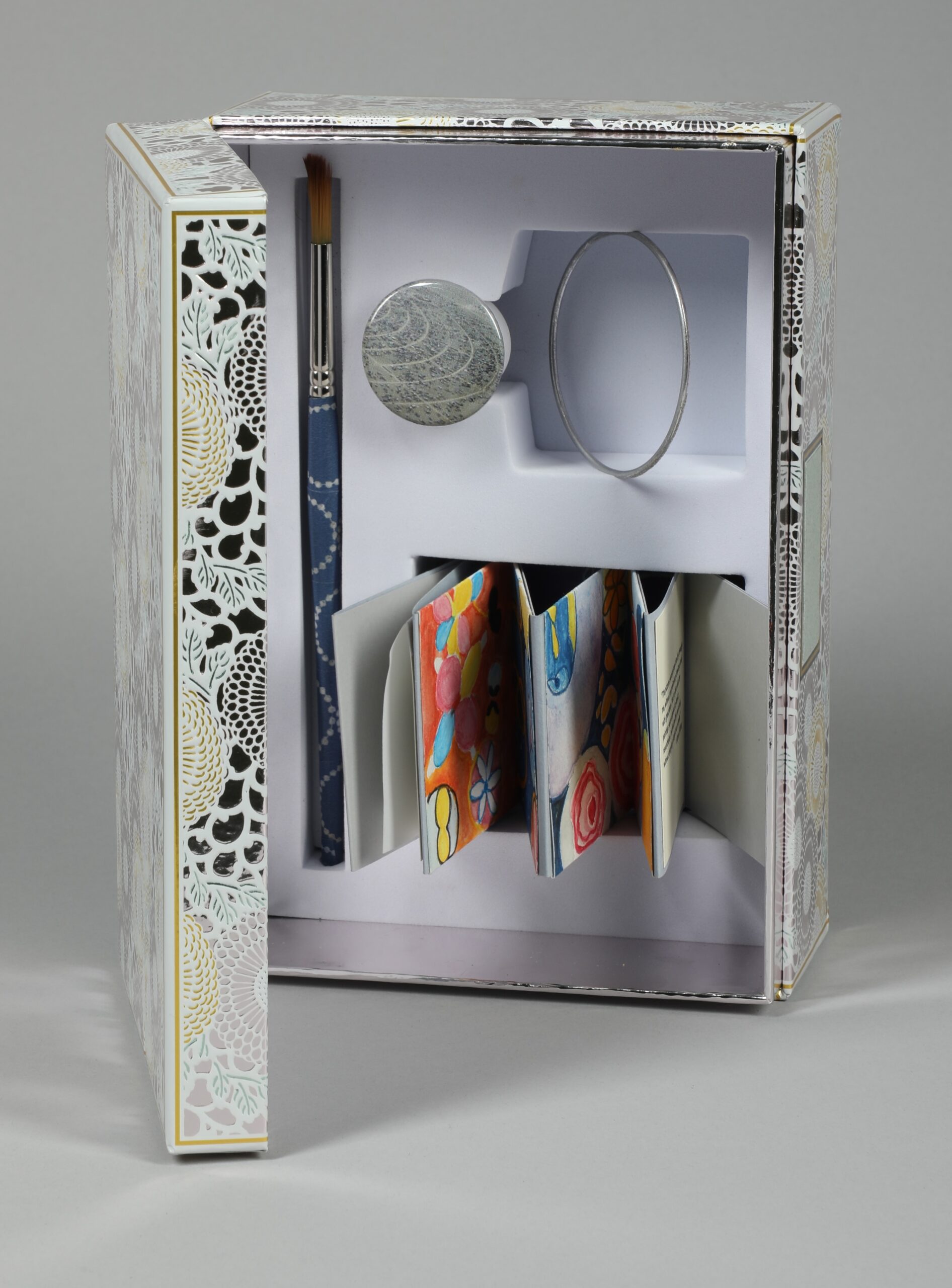 Image showing open box with folded-up papers inside.