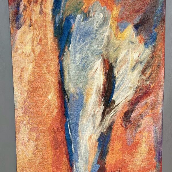 Image shows tapestry in shades of orange and blue