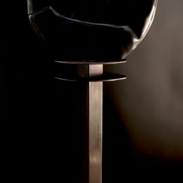 Image showing dark spiral stone on pedestal