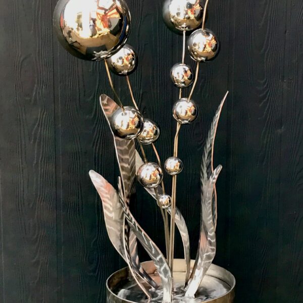 Gold ball-like flowers in a sculpture