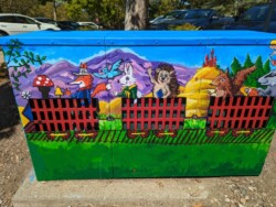 Utility box by Tim Hancock, located by the exit to the community center