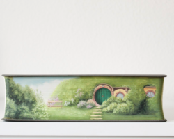Artist: Hedaya Hasan
Title: The Shire
Size: 8 x 2 x 5.5
Medium: Watercolor on Book Edge
Price: $565